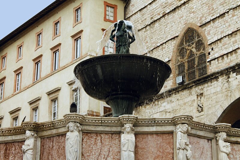 Fontana Maggiore, a fountain in Perugia city center with Cattedrala San Lorenzo in the background