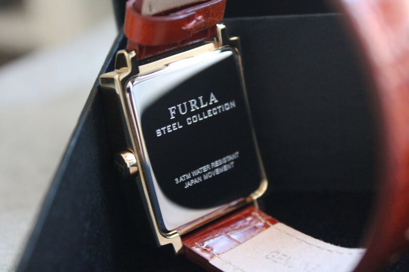 Back of a gold Furla classy ladies watch