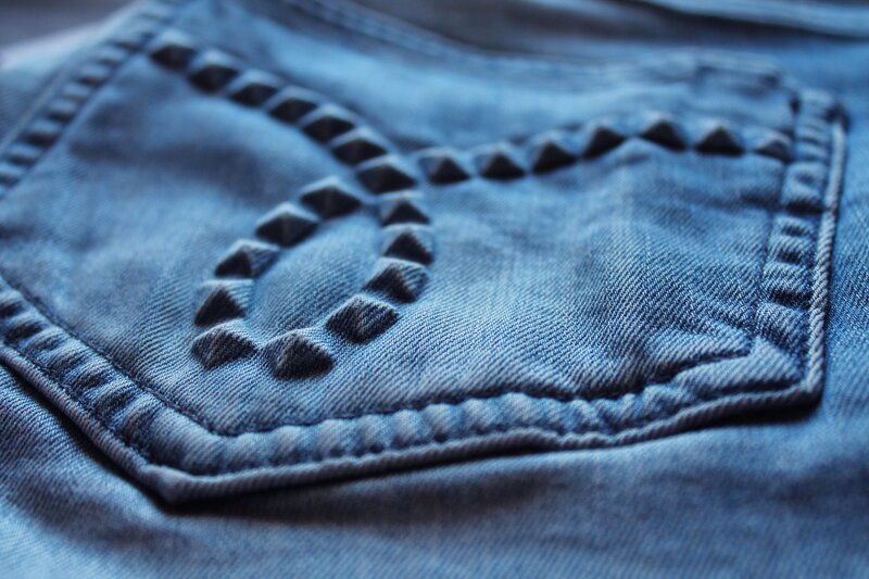 Calvin Klein blue jeans embossed back pocket