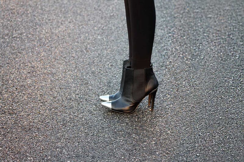 Fashion blogger Aurora Berill wearing black pointed toe boots