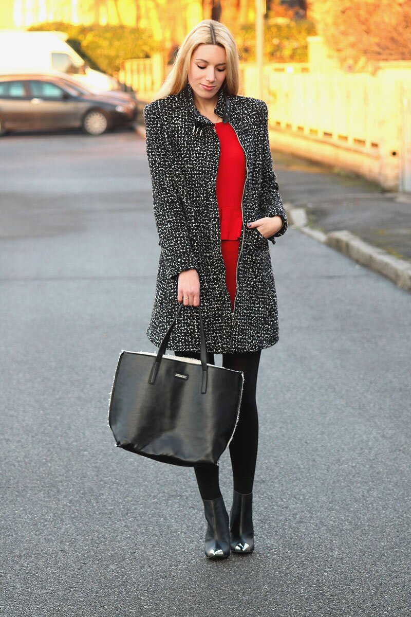 Fashion blogger Aurora Berill wearing a little red dress from Zara with a bouclé wool coat