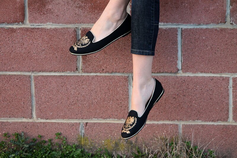 Fashion blogger Aurora Berill wearing Pittarello black and gold loafers